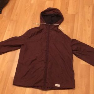 Dark colored zip up sweater